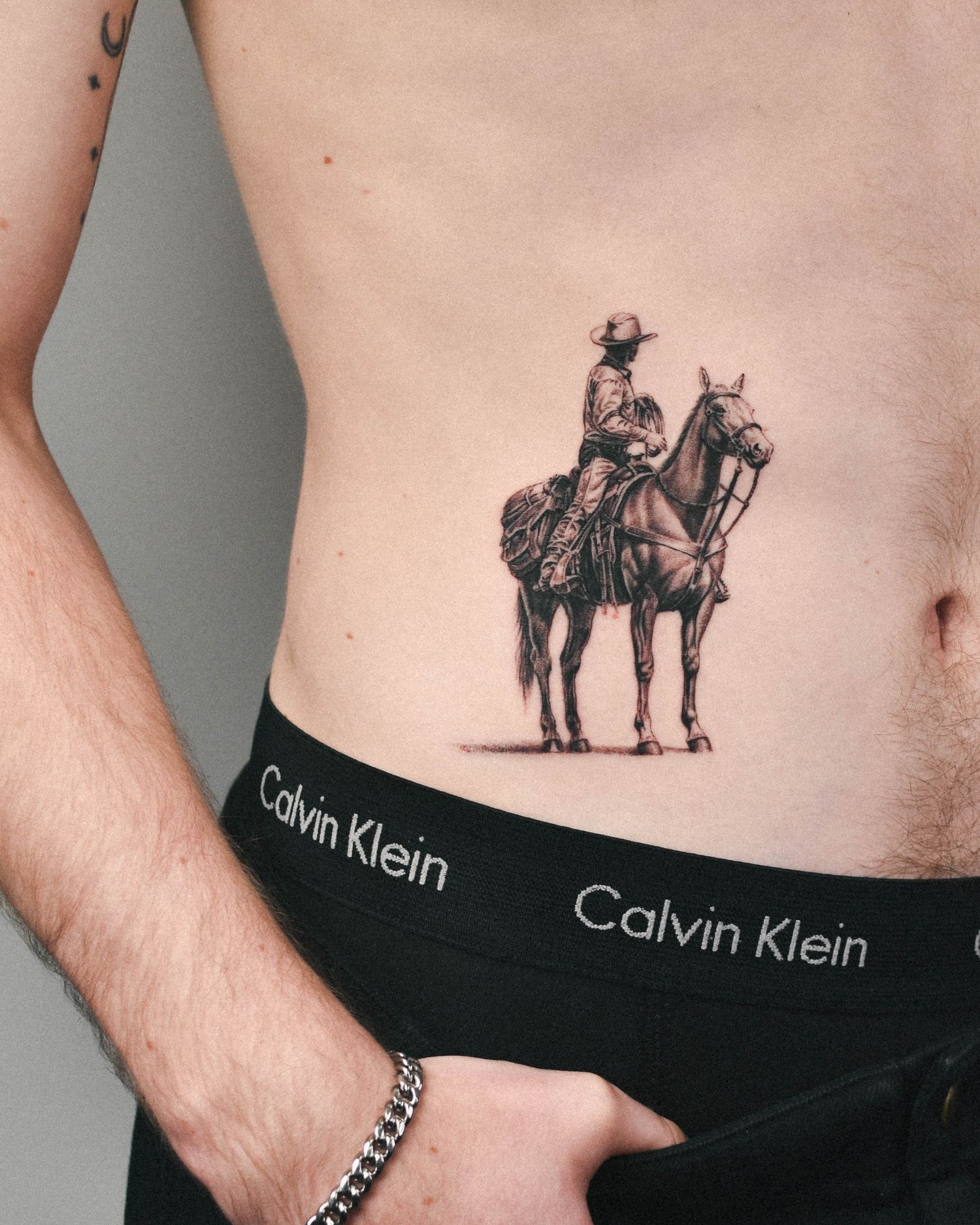 Tattoo — cowboy on horseback, hip