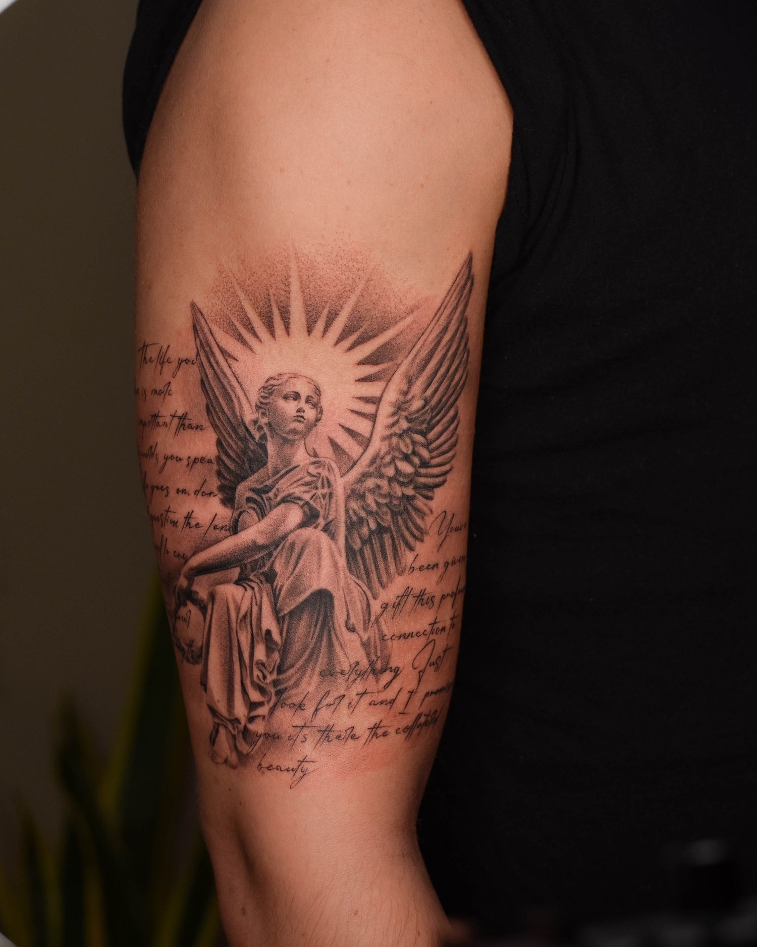 Tattoo — angel with script, bicep