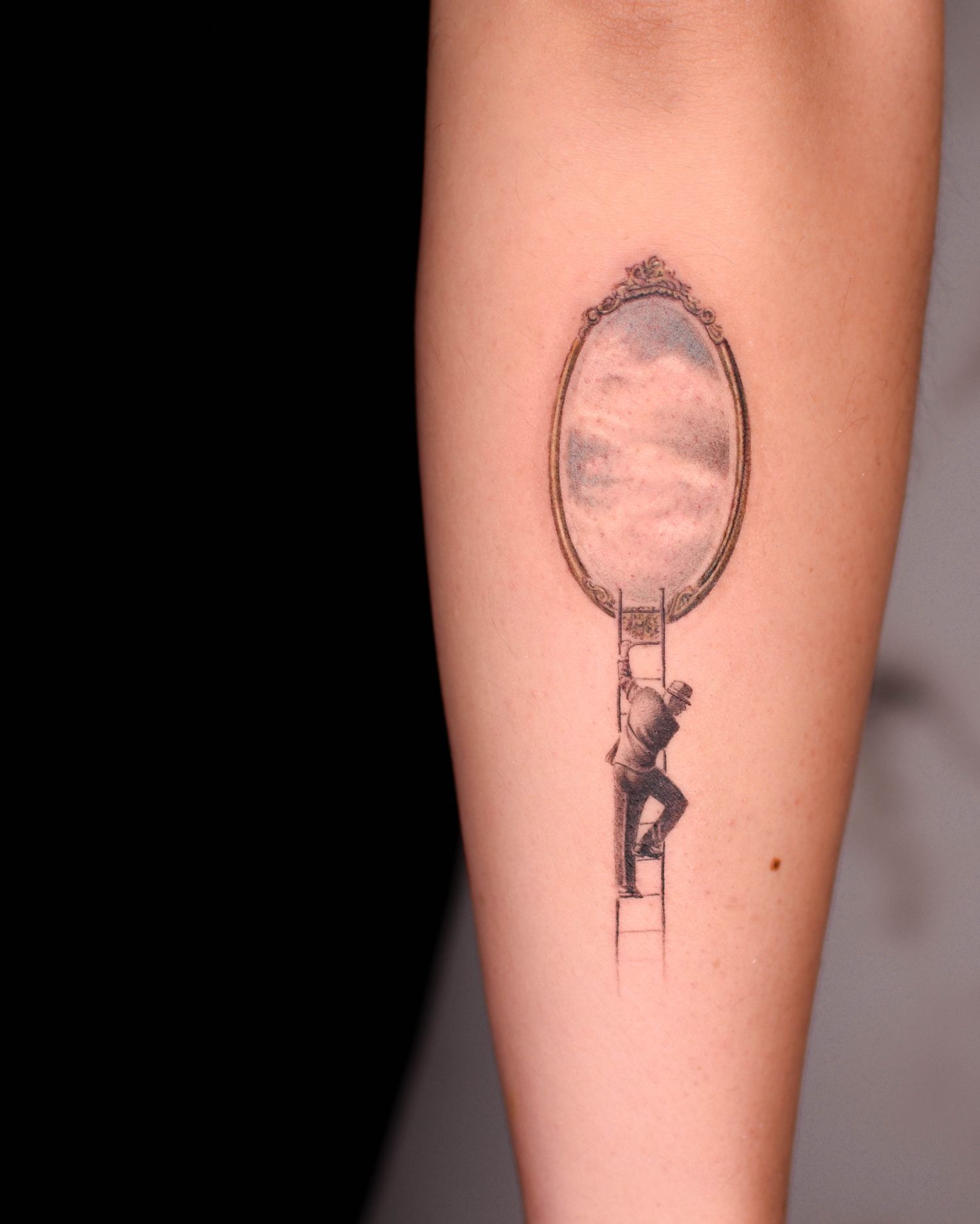 Tattoo — figure climbing a ladder to a mirror