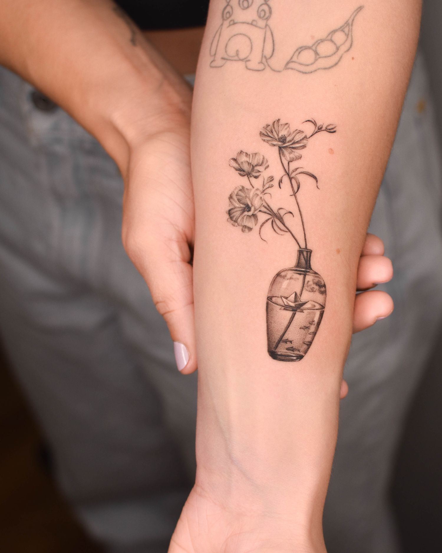 Tattoo — flowers in a glass vase